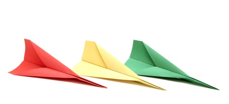 red yellow and green paper plane on white backgroundの写真素材