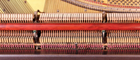 closeup of the inside of an old pianoの写真素材