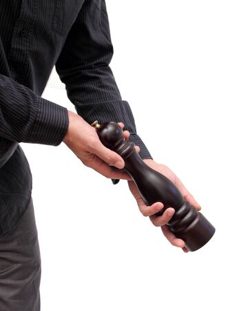 closeup of a man presenting a pepper-millの写真素材