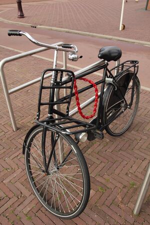 black bicycle with red chainの写真素材