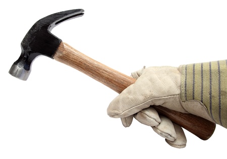 closeup of hand with glove holding a hammerの写真素材