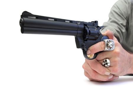 closeup of two hands pointing a gun over whiteの写真素材