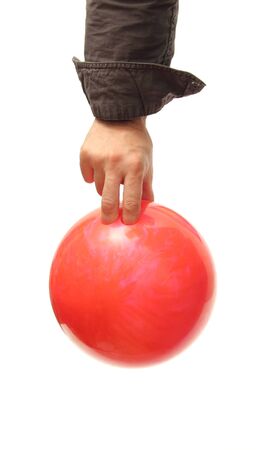 closeup of a hand holding a bowling ball over whiteの写真素材