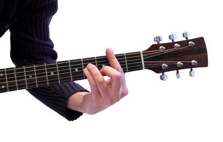closeup of a hand using a wood guitarの写真素材