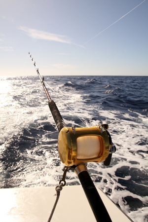 fishing rod with reel trolling on a boatの写真素材