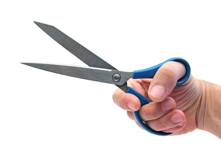 hand holding scissors over whiteの写真素材