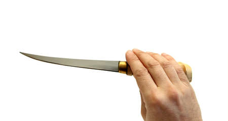 closeup of a hand holding a fish fillet knifeの写真素材