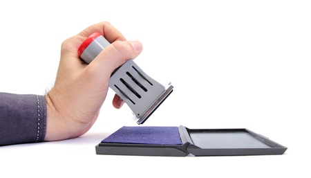  hand holding a ink stamperの写真素材