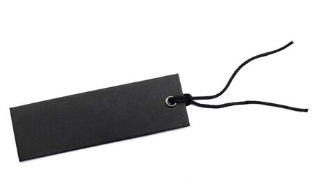 black sales tag with cord over whiteの写真素材