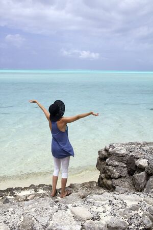 woman admiring the lagoon of bora boraの写真素材