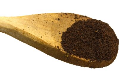 closeup of a wood spoon with grind coffee in itの写真素材