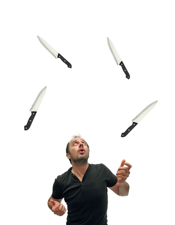 juggler using knives over whiteの写真素材