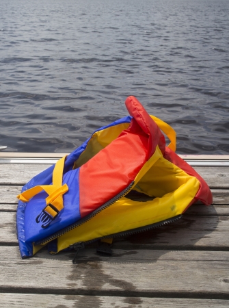 closeup of a life jacket on a pierの写真素材