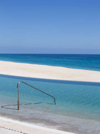 luxurious beach pool in mexicoの写真素材