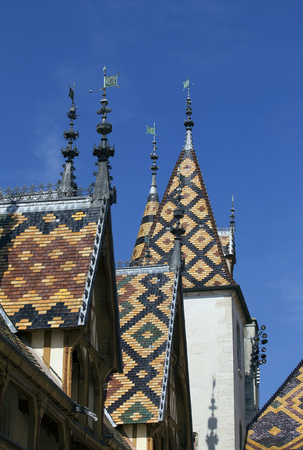 famous roofs of the old hospice of beaune in franceのeditorial素材