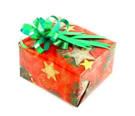 Christmas gift box with green bow isolated on white backgroundの写真素材
