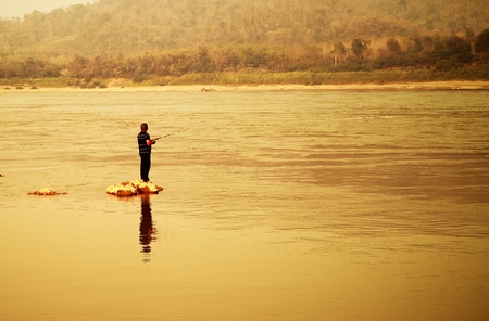 Man fishing in Mekong river at Loei, Thailandの写真素材