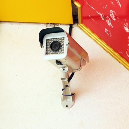 Security surveillance camera on the wallの写真素材
