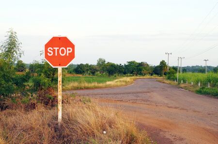 stop sign in a country roadの写真素材
