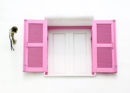 Greek Style windows with cctv on wallの写真素材