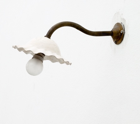 electric lamp against a wallの写真素材