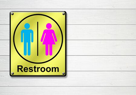 golden restroom sign on white wooden wall backgroundの写真素材