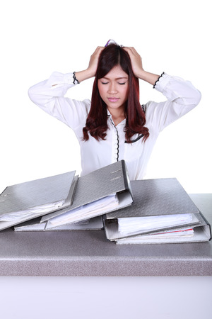 business woman worried with folder documents on desk isolated on white backgroundの写真素材