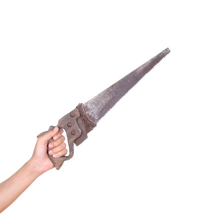 hand with old saw isolated on white backgroundの写真素材