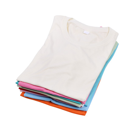 stack of colorful folded t-shirt isolated on white background (with clipping path)の写真素材