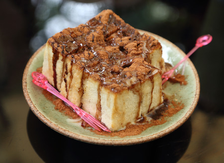 bread with chocolate powder and chocolate creamの写真素材
