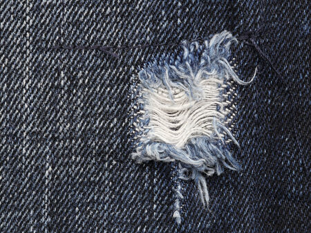 close up of torn old blue jeans の写真素材