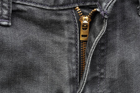 Close up of black jeans zipperの写真素材