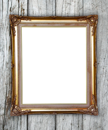 blank golden frame on wood wall backgroundの写真素材
