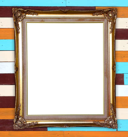 blank golden frame on wood wall background
