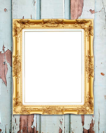 blank golden frame on wood wall backgroundの写真素材