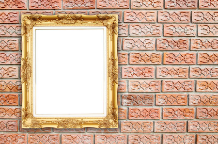 blank golden frame on brick stone wall backgroundの写真素材