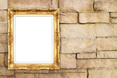 blank golden frame on brick stone wall backgroundの写真素材