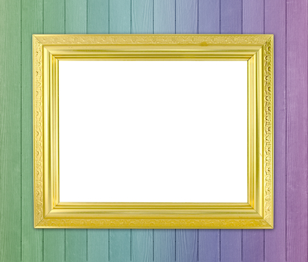 blank golden frame on color wood wall backgroundの写真素材