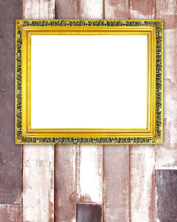blank golden frame on wood wall backgroundの写真素材