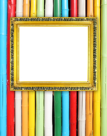 blank golden frame on colorful bamboo wall backgroundの写真素材