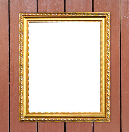 blank golden frame on wood wall backgroundの写真素材