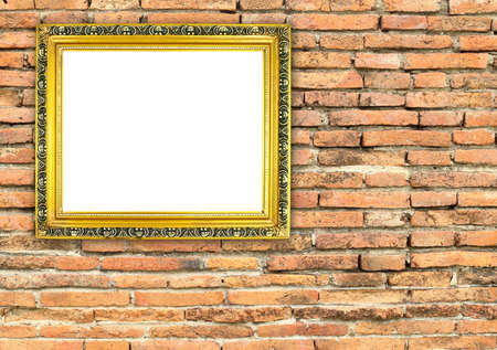 blank golden frame on brick stone wall backgroundの写真素材