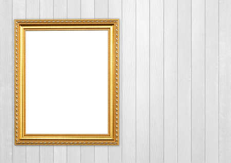 blank golden frame on wood wall backgroundの写真素材
