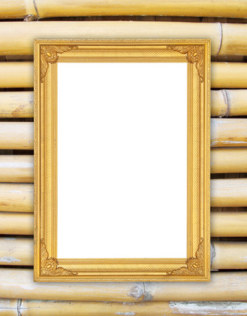 blank golden frame on bamboo wall backgroundの写真素材