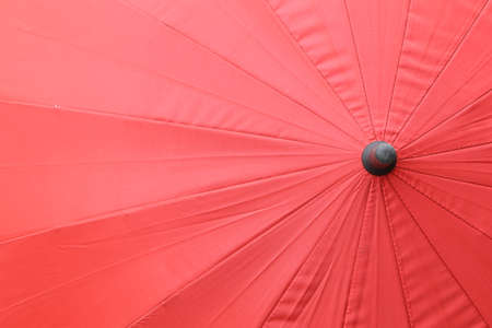 Close up top view texture of red umbrellaの写真素材