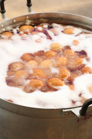 Eggs boiled with water in the big potの写真素材