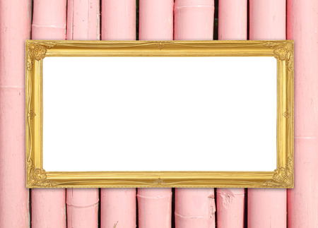 blank golden frame on colorful bamboo wall backgroundの写真素材