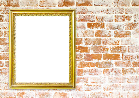 blank golden frame on brick stone wall backgroundの写真素材