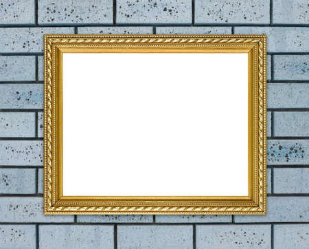blank golden frame on brick stone wall backgroundの写真素材