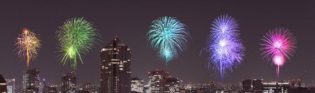 Fireworks celebrating over Tokyo cityscape at night, Japan (panorama)のeditorial素材